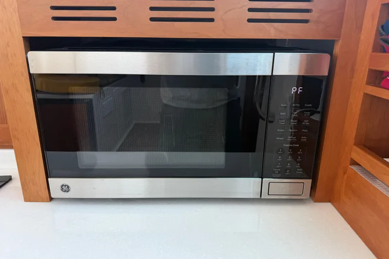 Slide: The Image of Built-in GE microwave in 2024 Back Cove 372 yacht kitchen. - 53