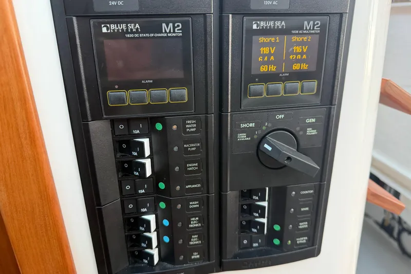 Slide: The Image of Electrical panel of 2024 Back Cove 372 boat with Blue Sea Systems M2 monitors. - 37