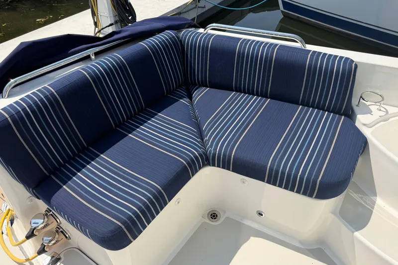 Slide: The Image of 2024 Back Cove 372 boat with blue striped seating on deck. - 71