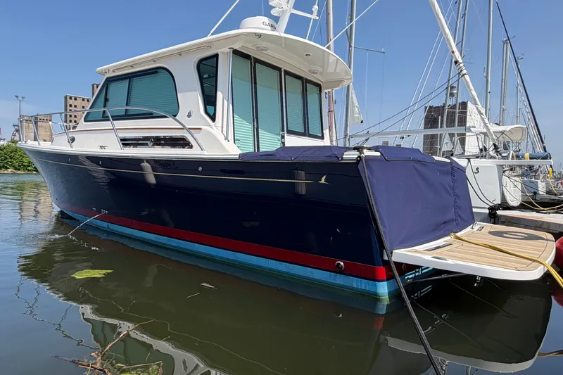 Slide: The Image of 2024 Back Cove 372 yacht docked, featuring sleek design and modern amenities. - 79