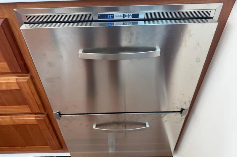 Slide: The Image of Stainless steel dishwasher with dual drawers, integrated in wooden cabinetry. - 51