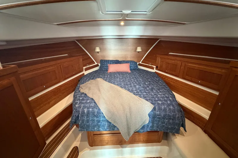 Slide: The Image of Luxurious cabin interior of 2024 Back Cove 372 yacht with cozy bedding. - 30