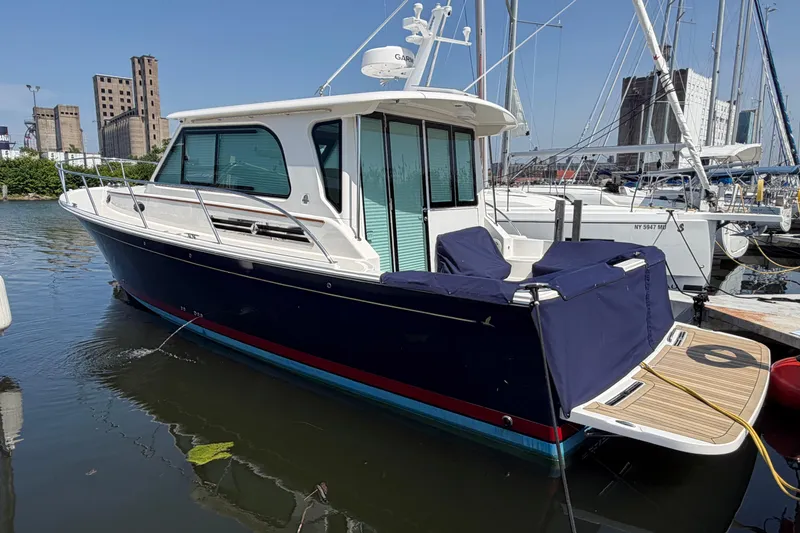 Slide: The Image of 2024 Back Cove 372 yacht docked in marina, featuring sleek design and modern amenities. - 78