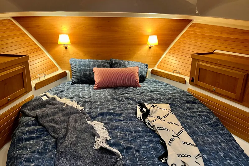 Slide: The Image of Cozy cabin interior of 2024 Back Cove 372 with wooden accents and soft lighting. - 26