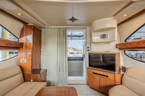 Slide: The Image of Interior of 2006 Meridian 341 Sedan yacht with modern furnishings and entertainment system. - 16