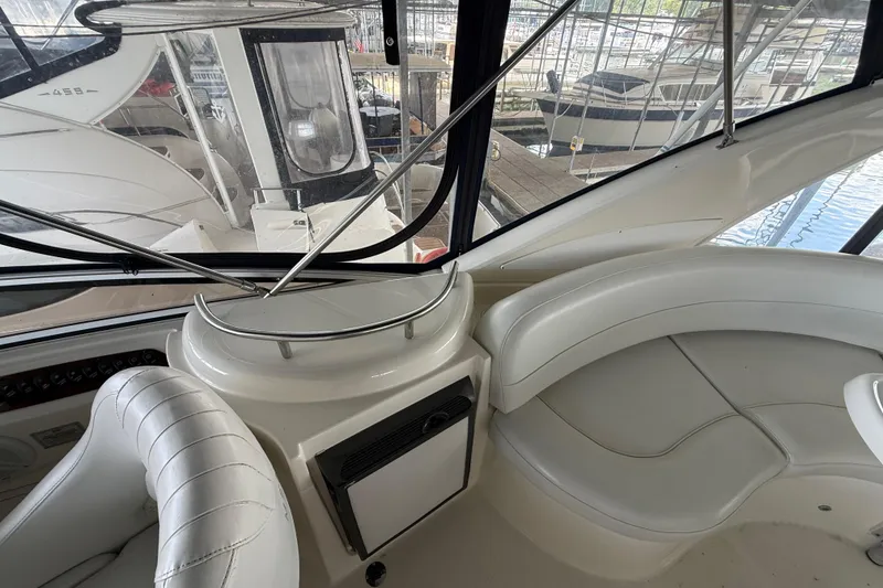 Slide: The Image of Interior of a 2006 Meridian 341 Sedan yacht with white leather seating and panoramic windows. - 21