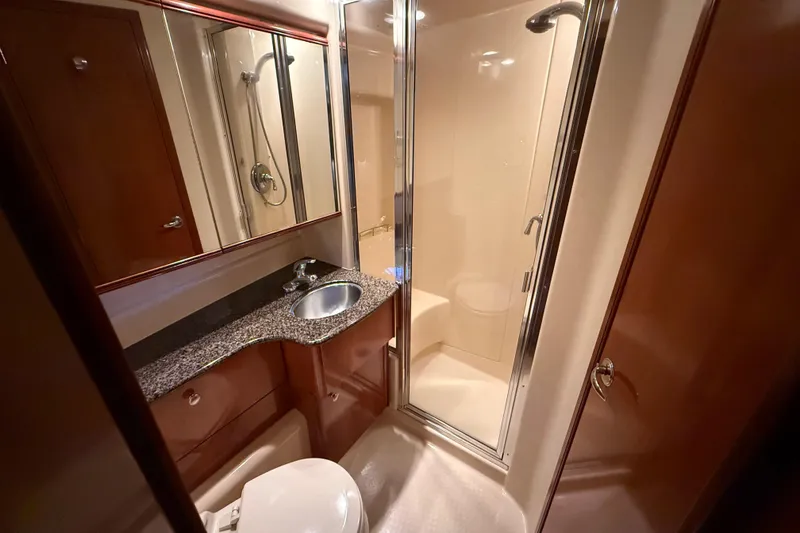 Slide: The Image of Luxurious bathroom in 2006 Meridian 341 Sedan yacht with shower and granite countertop. - 10