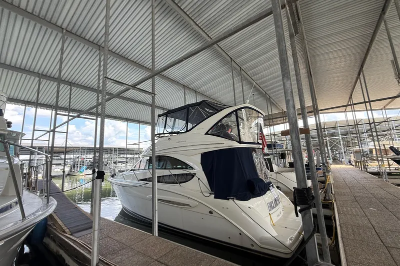 Slide: The Image of 2006 Meridian 341 Sedan yacht docked in a covered marina. - 3