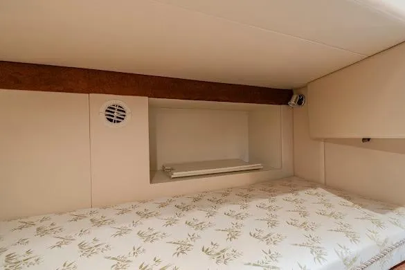 Slide: The Image of Interior cabin of 2006 Meridian 341 Sedan with floral-patterned bedding. - 24