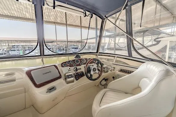 Slide: The Image of Helm of 2006 Meridian 341 Sedan yacht with modern controls and panoramic windows. - 12