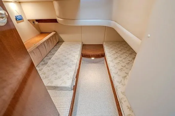 Slide: The Image of Interior cabin of 2006 Meridian 341 Sedan with twin beds and wooden accents. - 27