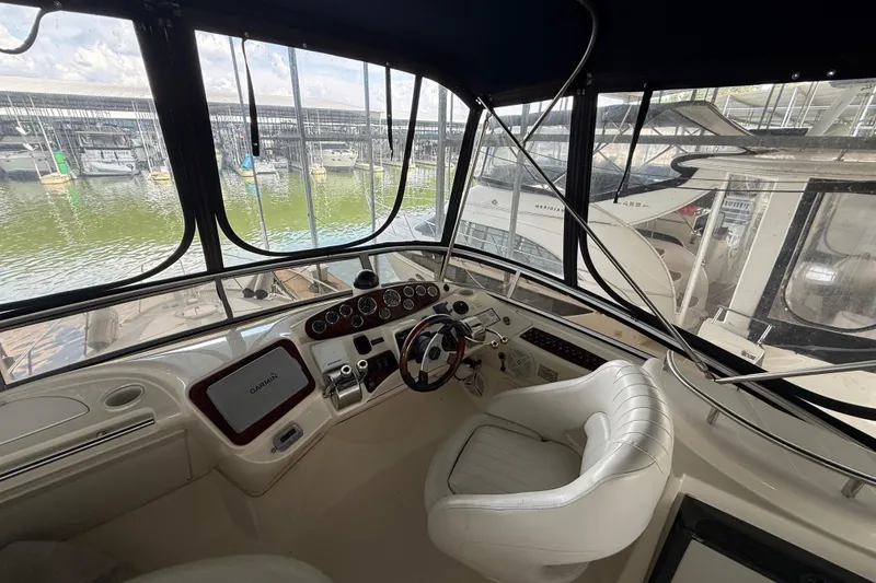 Slide: The Image of Helm of 2006 Meridian 341 Sedan yacht with Garmin navigation system, docked at marina. - 19