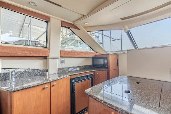 Slide: The Image of Interior of 2006 Meridian 341 Sedan yacht with modern kitchen amenities. - 19