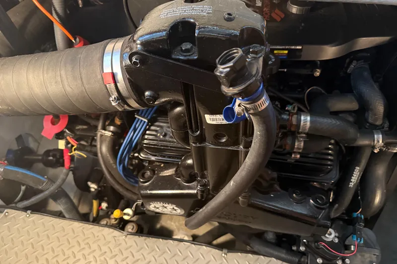 Slide: The Image of Engine compartment of a 2006 Meridian 341 Sedan, showcasing hoses and components. - 15