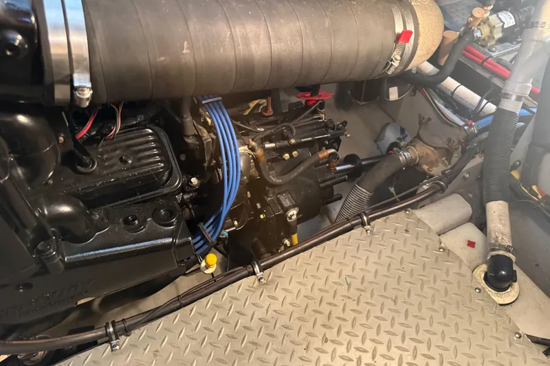 Slide: The Image of Engine compartment of a 2006 Meridian 341 Sedan with visible components and wiring. - 14