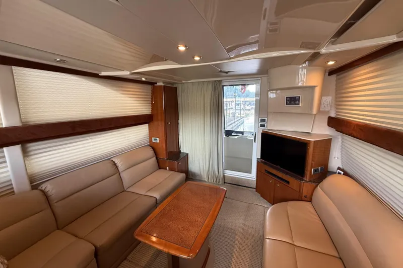 Slide: The Image of Luxurious interior of a 2006 Meridian 341 Sedan yacht with leather seating and entertainment system. - 6