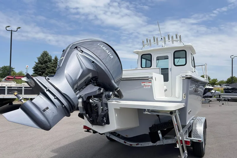 Slide: The Image of 2027 Parker 227 Explorer boat with Yamaha outboard motor on trailer. - 3