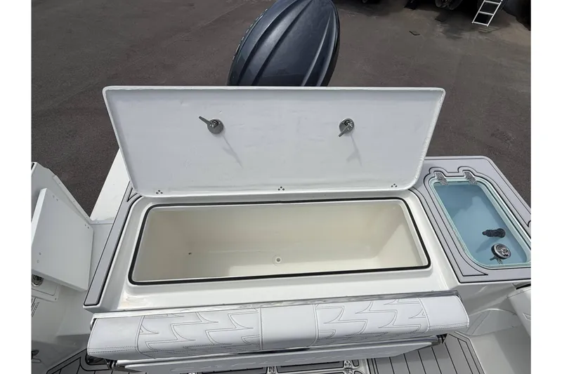 Slide: The Image of Open storage compartment on a 2027 Parker 227 Explorer boat deck. - 7