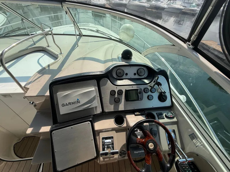 Slide: The Image of The cockpit of a 2004 Cruisers Yachts 400 Express with modern electronics. - 5