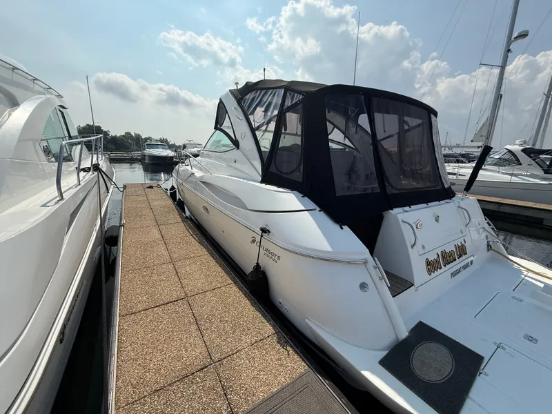 Slide: The Image of A 2004 Cruisers Yachts 400 Express docked on a sunny day. - 1