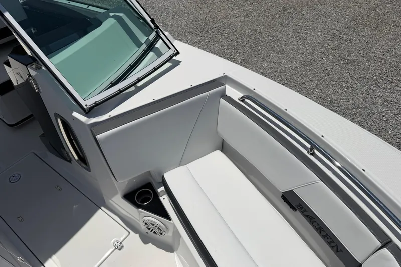 Slide: The Image of 2020 Blackfin 242 DC boat interior with seating and cup holder. - 42