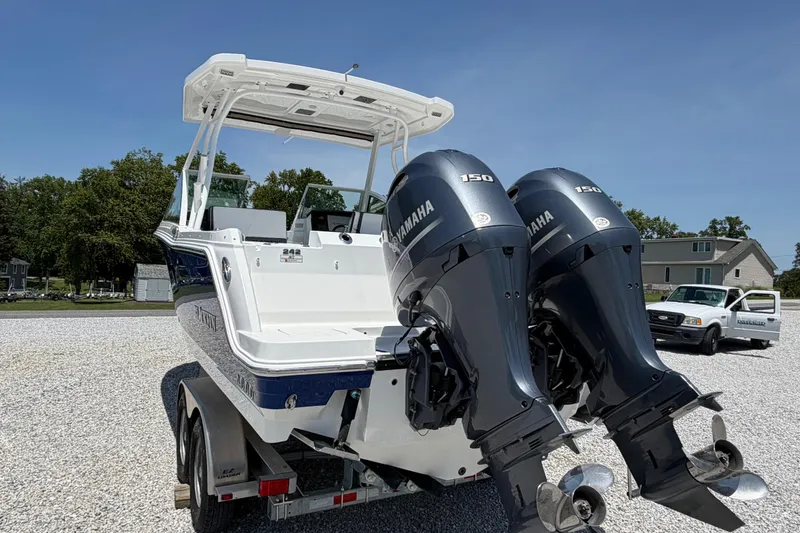 Slide: The Image of 2020 Blackfin 242 DC boat with dual Yamaha 150 engines on a trailer. - 15