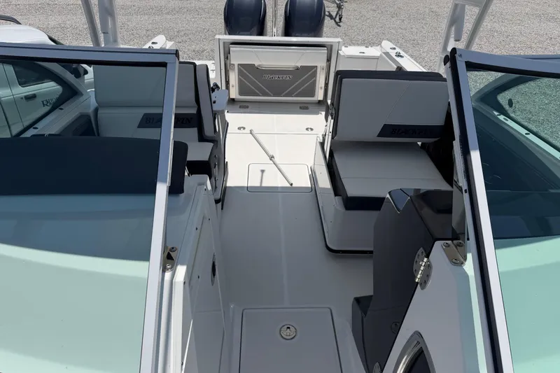 Slide: The Image of 2020 Blackfin 242 DC boat interior with seating and open deck view. - 41