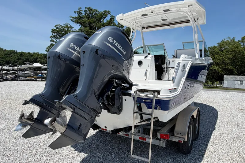 Slide: The Image of 2020 Blackfin 242 DC boat with dual Yamaha engines on a trailer. - 16