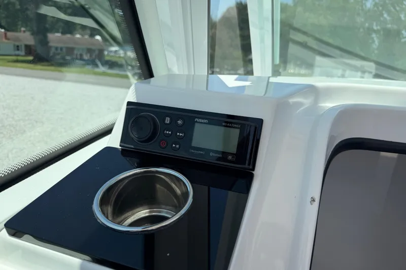 Slide: The Image of 2020 Blackfin 242 DC boat dashboard with Fusion stereo and cup holder. - 30