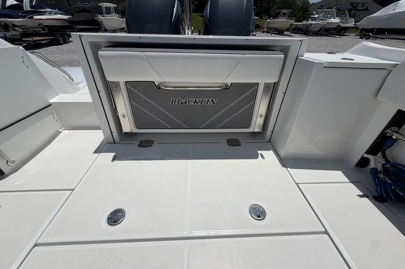 Slide: The Image of 2020 Blackfin 242 DC boat deck with storage compartment and sleek design. - 21