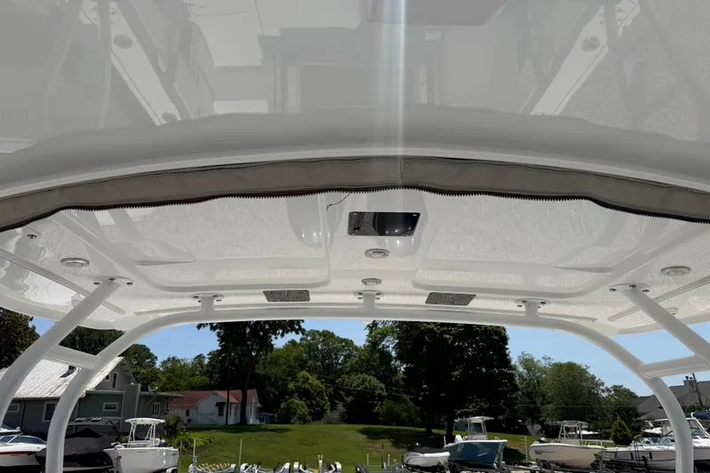 Slide: The Image of 2020 Blackfin 242 DC boat canopy with sleek design and integrated lighting. - 40