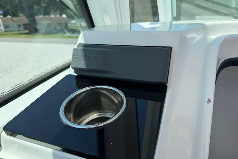 Slide: The Image of 2020 Blackfin 242 DC boat dashboard with Fusion stereo and cup holder. - 31