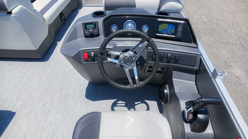 Slide: The Image of The image shows the helm of a 2027 Bennington 18 S CRUISE boat with modern instruments. - 21