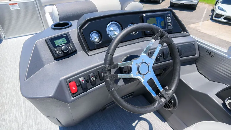Slide: The Image of The image shows the helm of a 2027 Bennington 18 S CRUISE boat with modern instruments. - 21