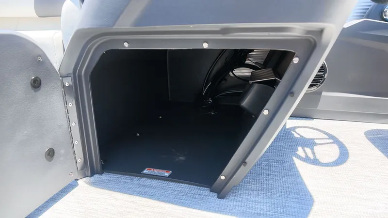 Slide: The Image of An open storage compartment on a 2027 Bennington 18 S CRUISE boat. - 18