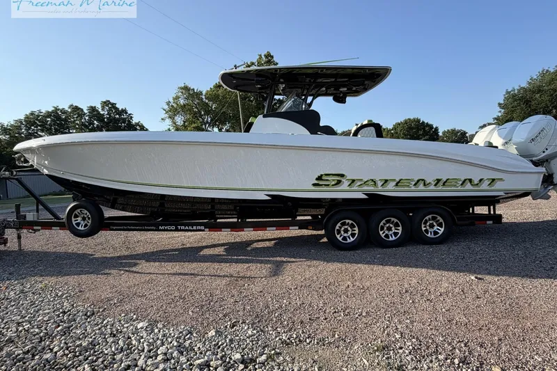 Slide: The Image of 2017 Statement 380 Open boat on trailer, side view, outdoors. - 9