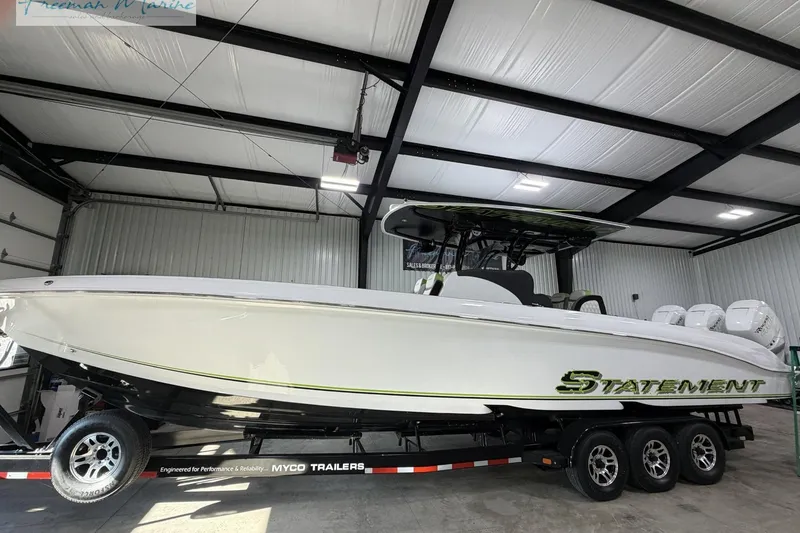 Slide: The Image of 2017 Statement 380 Open boat on trailer in indoor storage facility. - 33