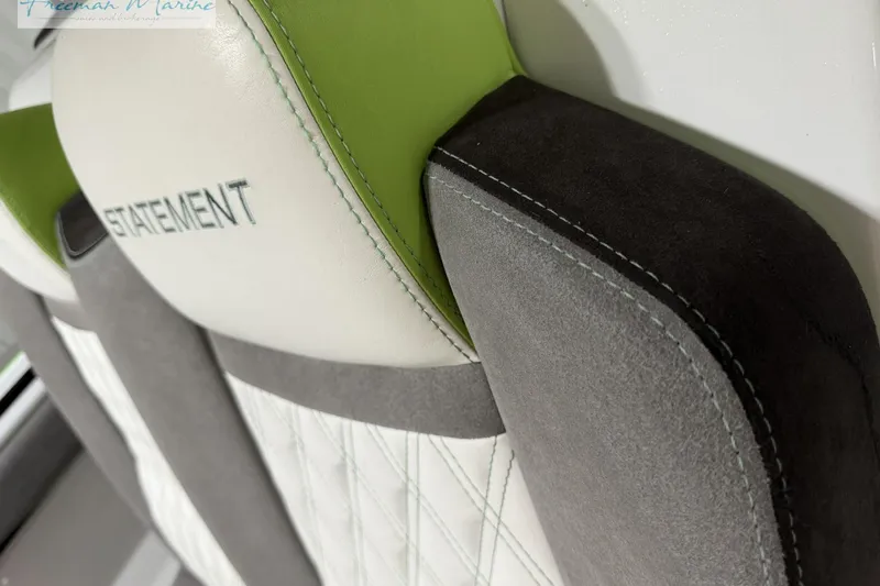 Slide: The Image of Close-up of 2017 Statement 380 Open boat seat with green and gray accents. - 32