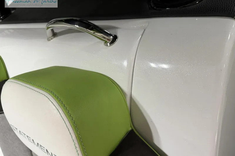 Slide: The Image of Green and white seating on 2017 Statement 380 Open boat with chrome handle. - 30