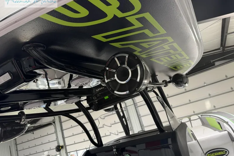 Slide: The Image of 2017 Statement 380 Open boat underside with speaker system in a garage setting. - 20