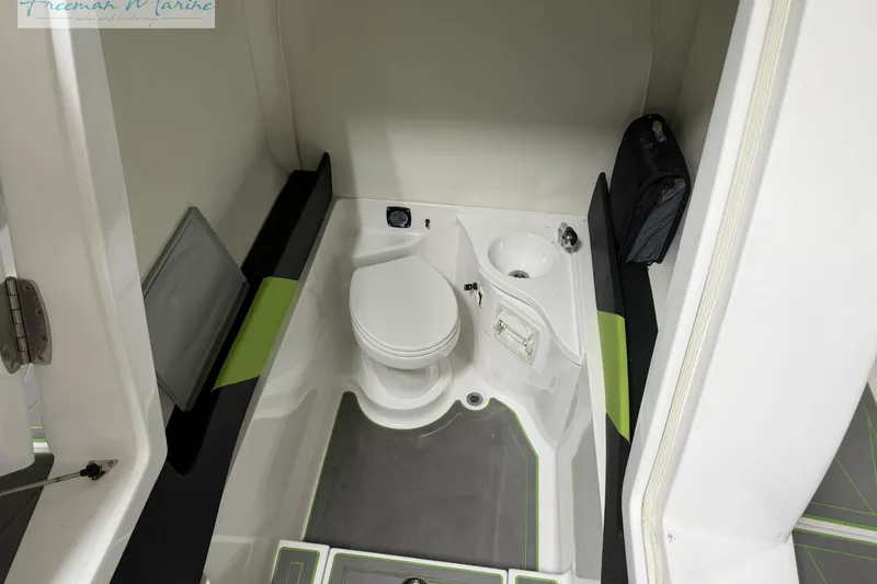 Slide: The Image of Compact bathroom in 2017 Statement 380 Open boat, featuring toilet and sink. - 29