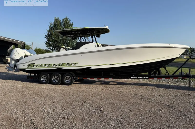 The Image of 2017 Statement 380 Open boat on trailer, parked outdoors under clear sky. - 1