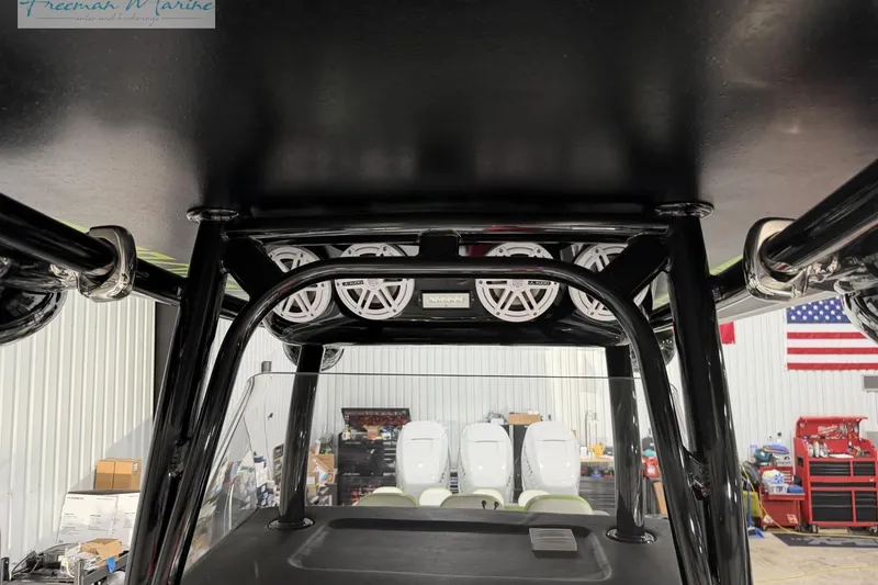 Slide: The Image of Interior view of 2017 Statement 380 Open boat with speakers and equipment in a workshop. - 17