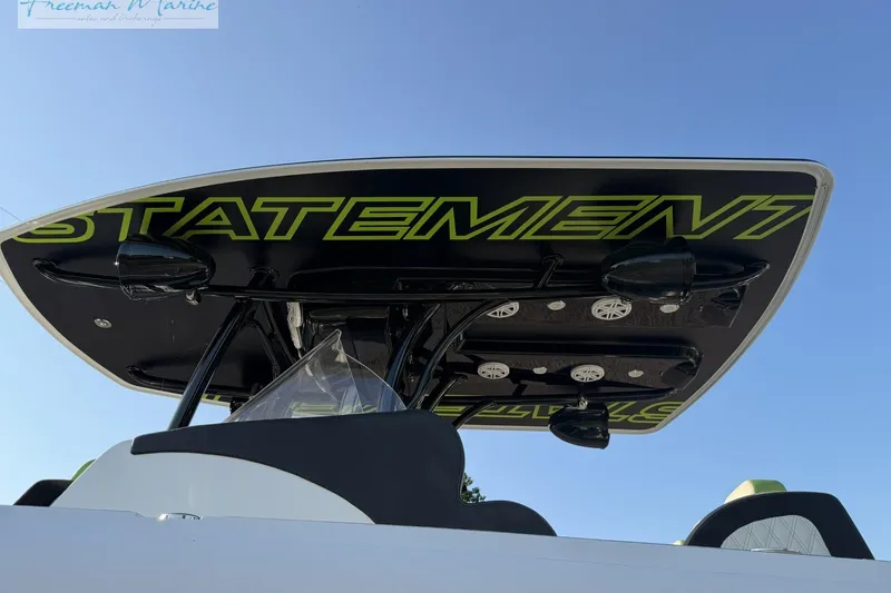Slide: The Image of 2017 Statement 380 Open boat with sleek black and green design, viewed from below. - 12