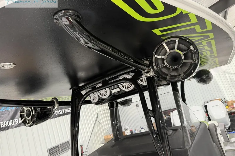 Slide: The Image of 2017 Statement 380 Open boat with custom audio system and sleek black framework. - 16