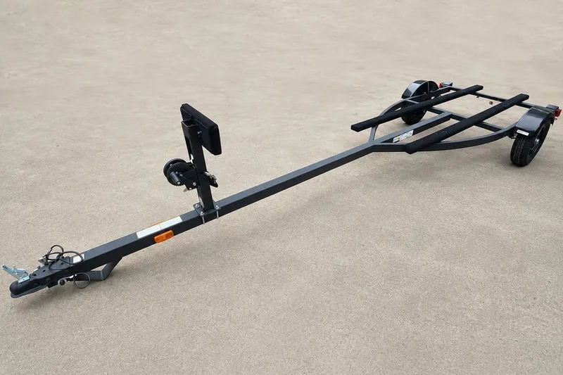 Slide: The Image of Trailer for 2026 Tracker Grizzly 12 Jon boat on concrete surface. - 4