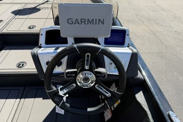 Slide: The Image of Steering wheel and Garmin display on 2026 Tracker Savage 215 boat. - 13