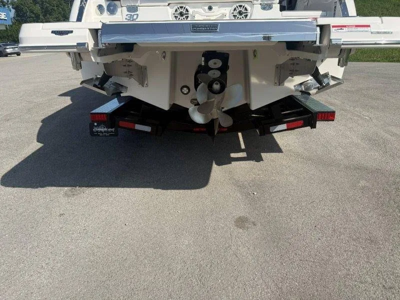 Slide: The Image of Rear view of a Chaparral SSX 30 boat with dual propellers. - 24
