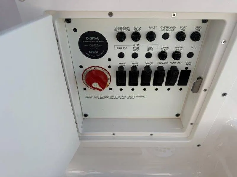 Slide: The Image of Electrical control panel with switches and knobs inside a boat. - 22