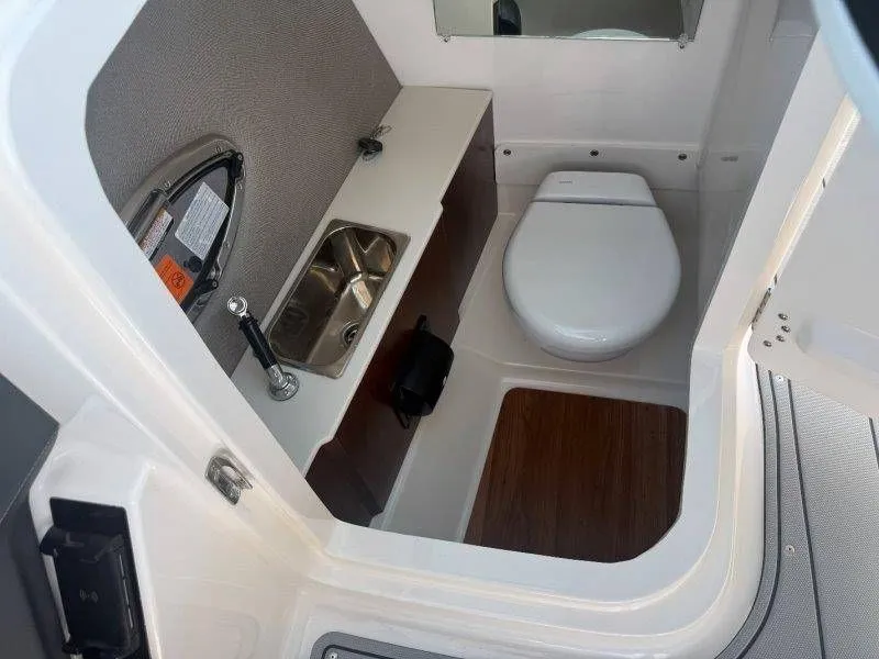Slide: The Image of Interior view of a boat cabin with a toilet and sink. - 19